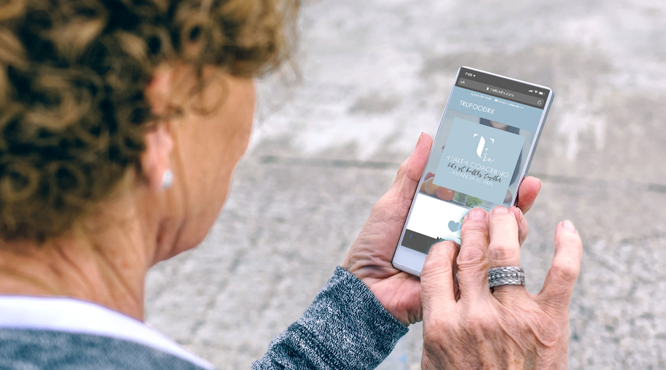 Senior athlete looking at mobile website on phone